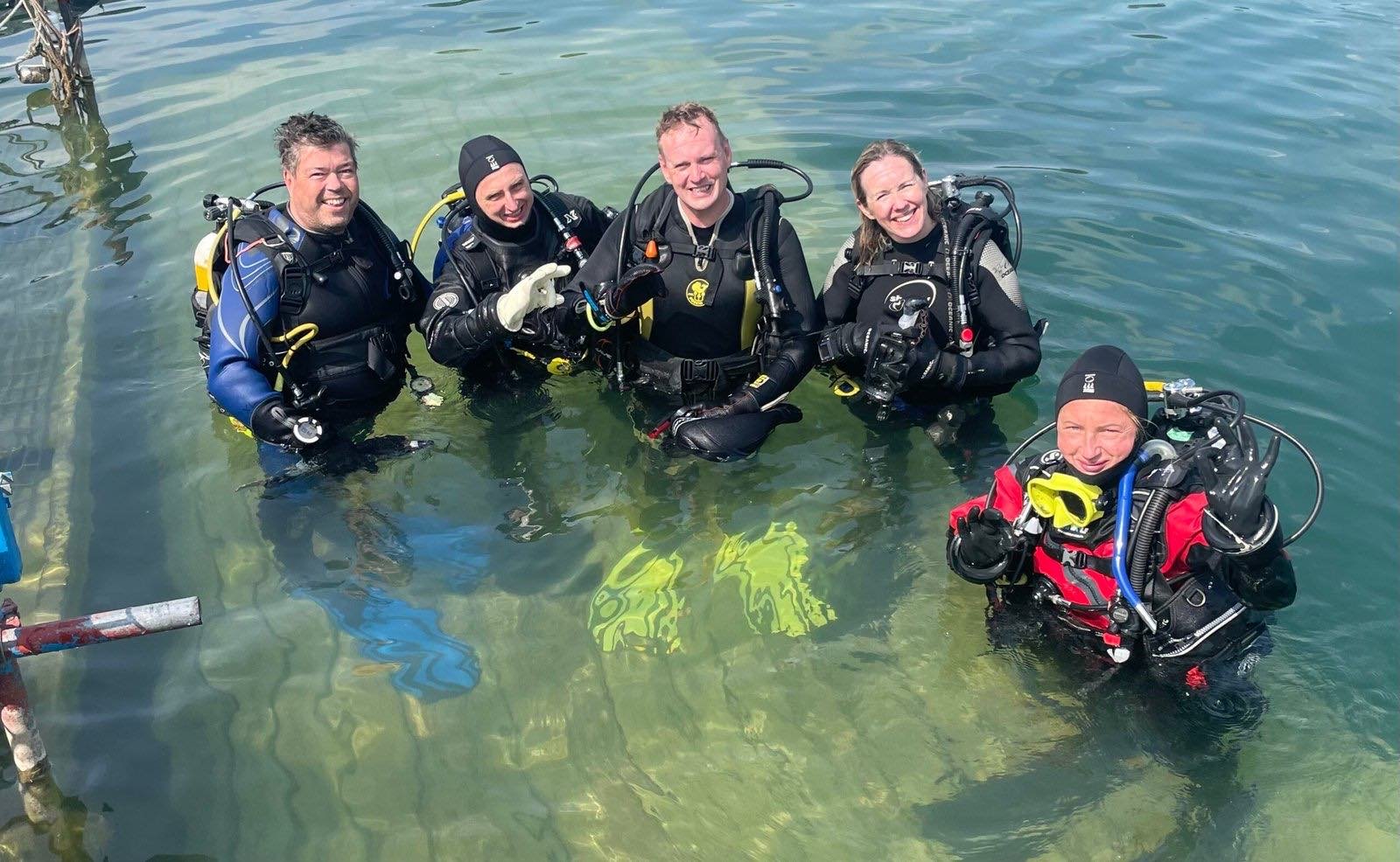 Five divers at the surface at Gildenburgh Water